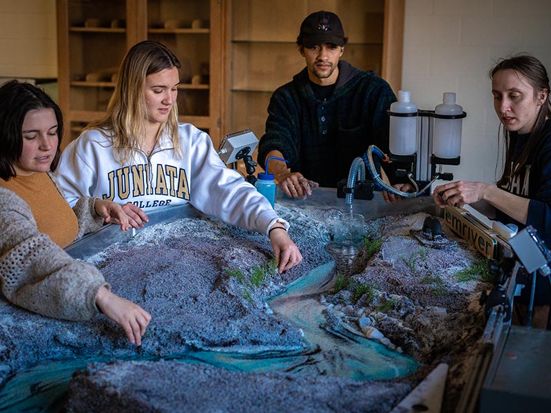 student using the river table