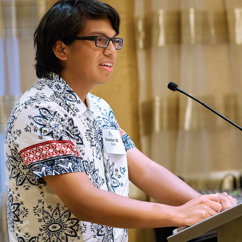 photo of student speaking at podium